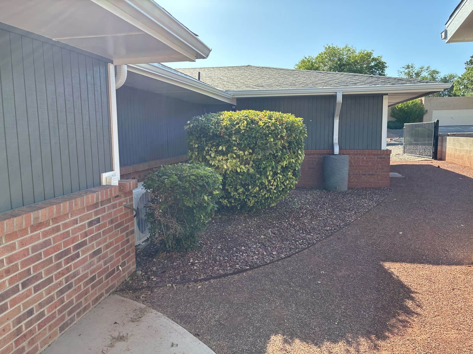 Neatly trimmed shrubs above a clean gravel bed